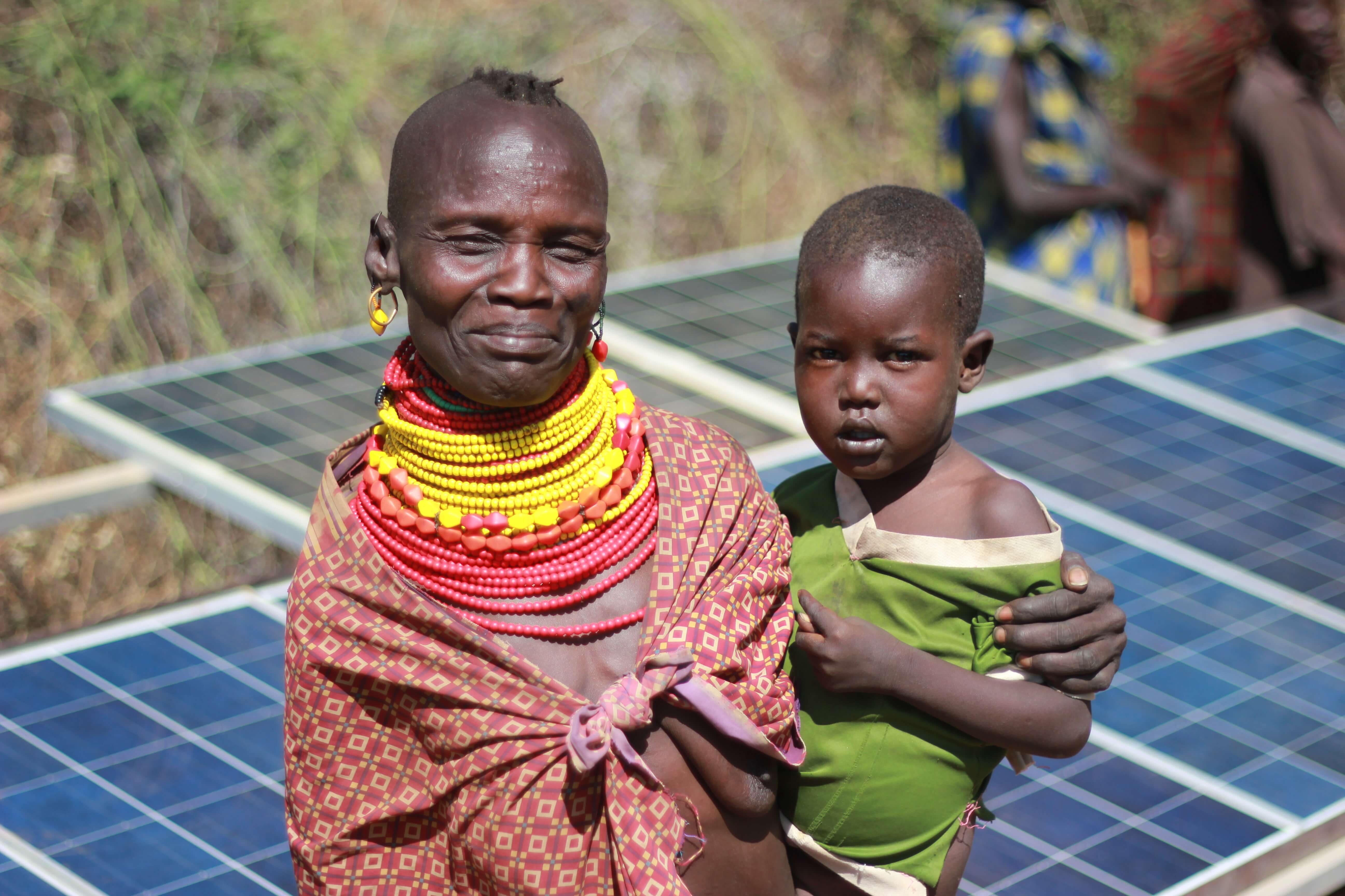 Mother, child and solar panel.jpg