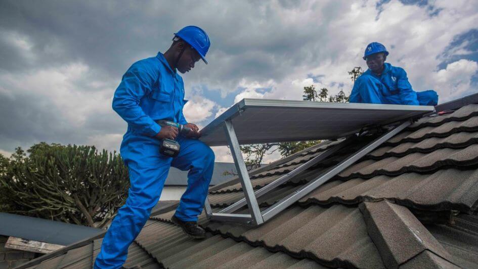 A BBOXX crew installing rooftop solar in the Democratic Republic of Congo