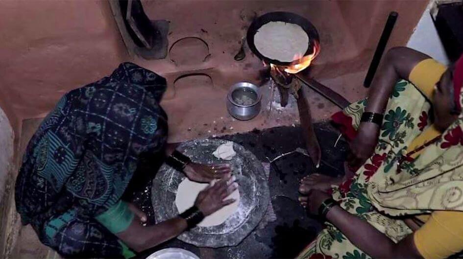 Prepping dinner over a wood fire